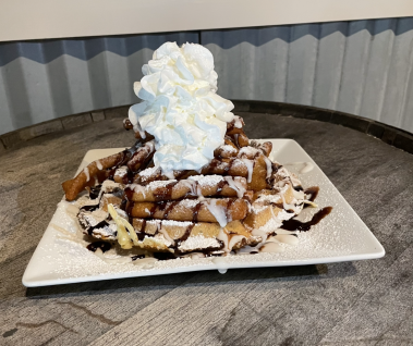 Churros Waffles - with cinnamon honey butter, fried chicken, cinnamon sugar, salted caramel, Mexican chocolate sauce